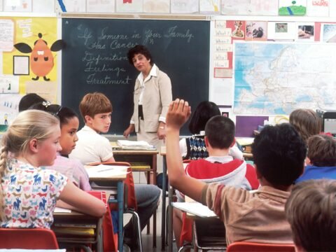 woman standing in front of children